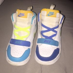 These are some Nike x Swoosh boys shoes